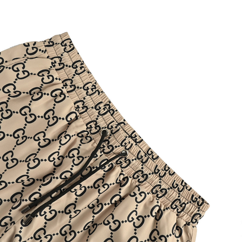 Gucci All-Over Dual-Letter Jacquard Swim Shorts – Sand / Blue Stripe Hem